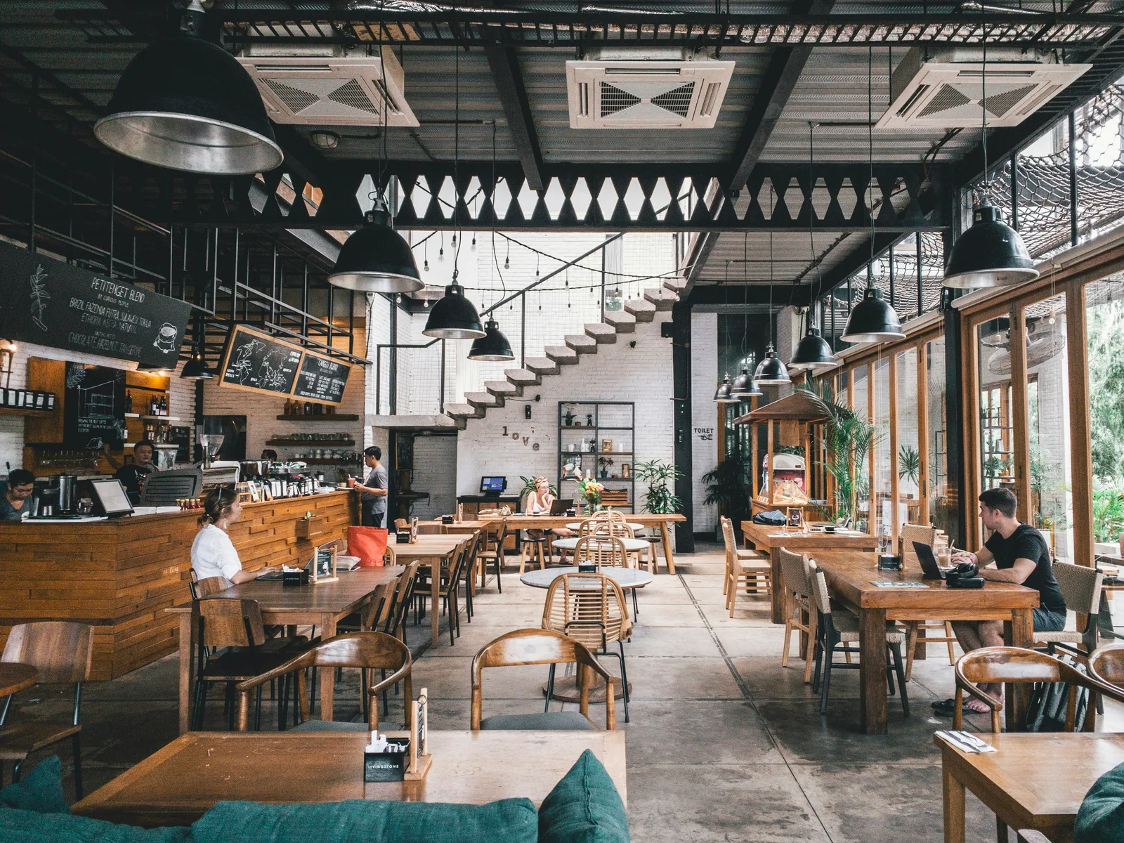 Vibrant Italian kitchen scene with chefs preparing fresh seasonal ingredients at open stations